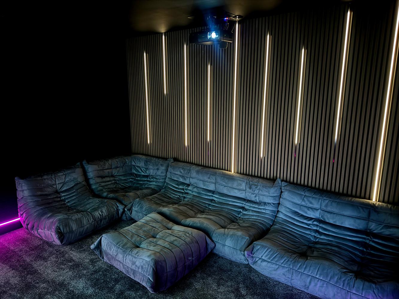 TV on media wall with cabinetry below